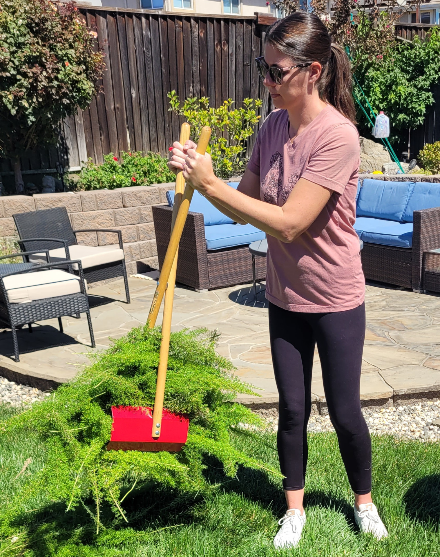 Gathering plant trimmings with the TerraBOSS on a lawn