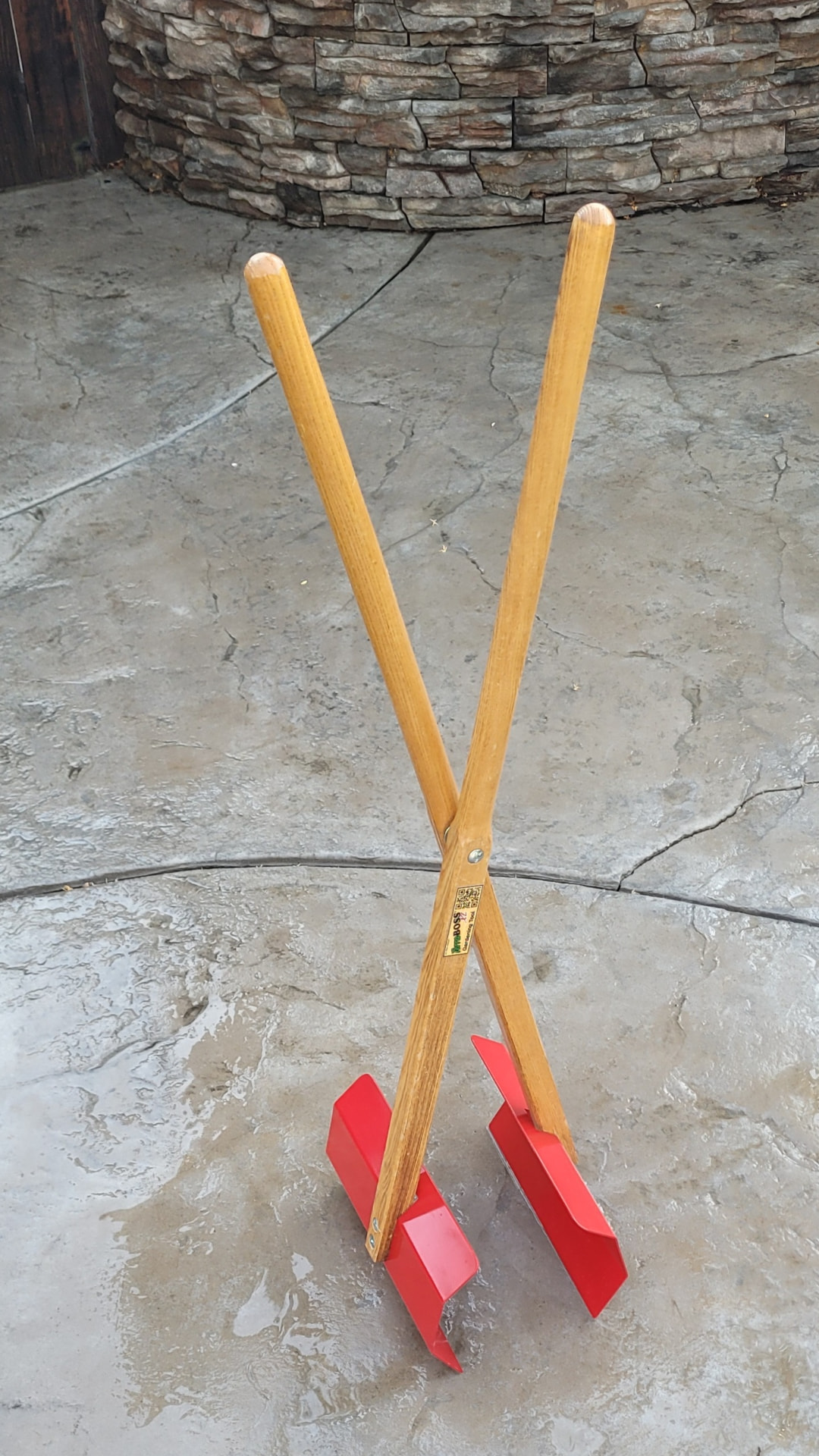 TerraBOSS XL Gardening Tool standing on a stone patio
